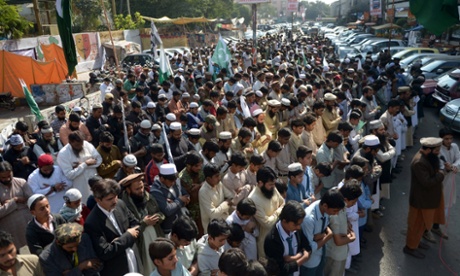 Activists of Jamaat ud Dawa offer memorial prayers for the victims of an attack by Taliban gunmen on an army-run school in Peshawar, in Lahore.