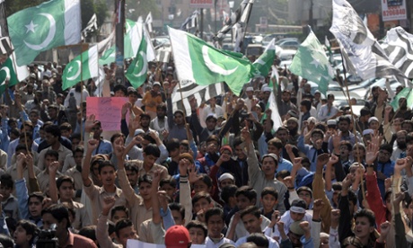 Activists of Jamaat ud Dawa shout slogans for the victims of an attack by Taliban gunmen on an army-run school in Peshawar, in Lahore.