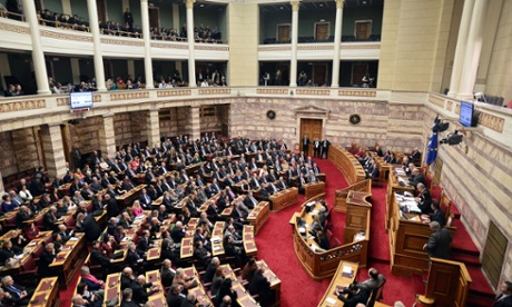 Lawmakers vote at the Greek parliament on Wednesday. Photo: Louisa Gouliamaki/AFP/Getty Images