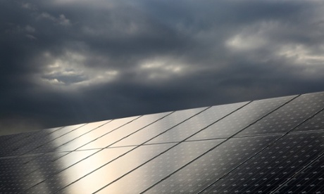Solar panels under stormy sky