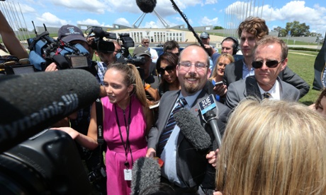MEP senator Ricky Muir surrounded by a media pack outside Parliament House in Canberra this morning.