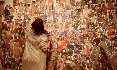 No More Page 3 campaigner working on their collage of six months of pictures of men and women from the Sun