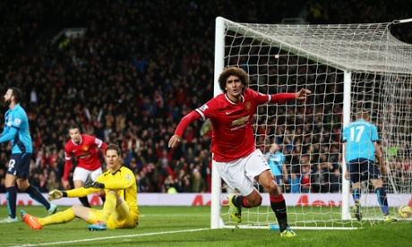 Marouane Fellaini celebrates after scoring the first goal for Manchester United.