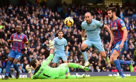 Pablo Zabaleta chips the ball over Crystal Palace's  goalkeeper Julian Speroni ...