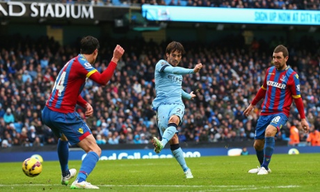 David Silva sweeps home his and City's second.