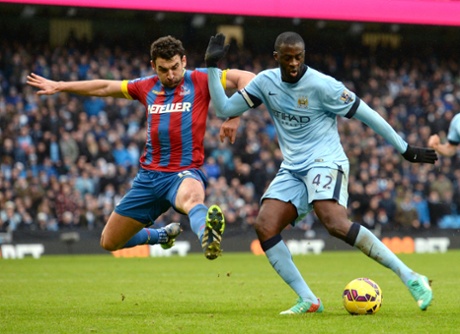 Despite the best efforts of Mile Jedinak, Yaya Toure makes it 3-0.