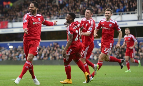 West Bromwich Albion's Joleon Lescott, left, celebrates with team-mates after opening the scoring against QPR