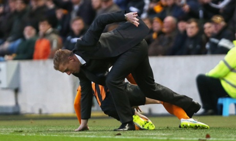 Easy Tiger. Swansea City manager Garry Monk gets in a tangle on the touchline with a Hull City player.