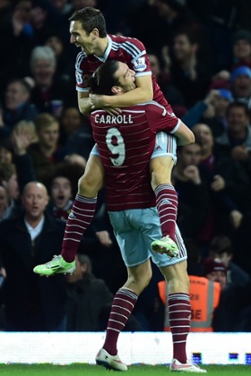 Stewart Downing celebrates his fine strike with fellow goalscorer Andy Carroll.