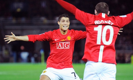 Wayne Rooney (R) of Britain's Manchester United celebrates with teammate Cristiano Ronaldo after scoring against Ecuador's Liga Deportiva Universitaria de Quito during the FIFA Club World Cup final soccer match in Yokohama, south of Tokyo, December 21, 2008. REUTERS/Kyodo (JAPAN).  FOR EDITORIAL USE ONLY. NOT FOR SALE FOR MARKETING OR ADVERTISING CAMPAIGNS. JAPAN OUT. NO COMMERCIAL OR EDITORIAL SALES IN JAPAN.:rel:d:bm:GF2E4CL14A701?u?J? ?[?v
