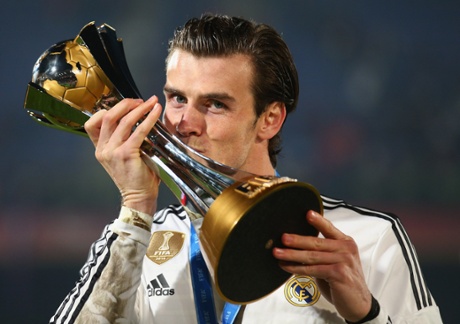 Goalscorer Gareth Bale plants a big smacker on the trophy.
