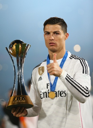 Cristiano Ronaldo can hardly contain his excitement at winning the trophy.
