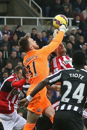 Jak Alnwick punches the ball clear