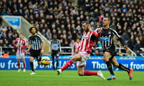 Steven Taylor looks on as Steven Fletcher of Sunderland fires a shot at goal
