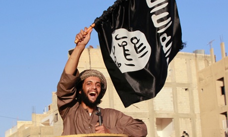 A militant Islamist fighter takes part in a military parade in Syria's northern Raqqa province.