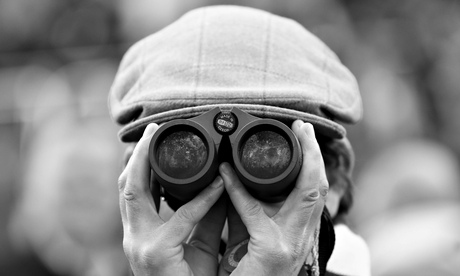 Man looking through binoculars