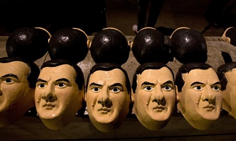 Rubber masks of chancellor George Osborne are lined up amid anti-austerity protesters.