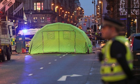 Police officer guards scene of the lorry crash in Glasgow.