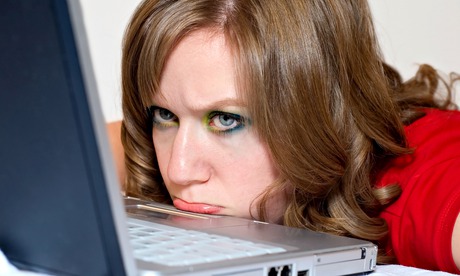 A woman frustrated with her laptop