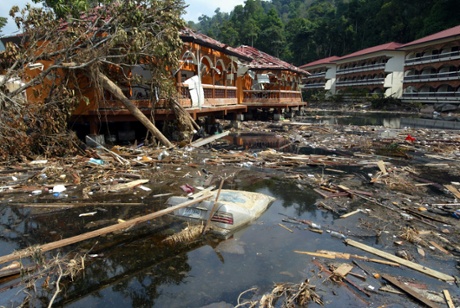 A Mercedes car submerged among debris in a pond of destroyed Khao Lak Laguna Resort by the tidal wave tsunami in Khao Lak south of Thailand. Taken on 3 Jnauary 2005