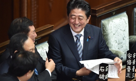 Smiles all round. Shinzo Abe in Parliament on Wednesday, shortly before being re-elected prime minister.