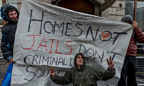 Members of Love Activists outside a former RBS building in central London
