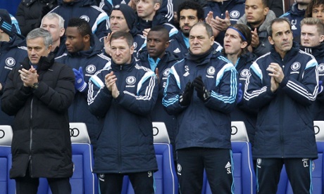 At Stamford Bridge the Chelsea bench applaud in memory of the WWI truce ahead of their match against West Ham United.