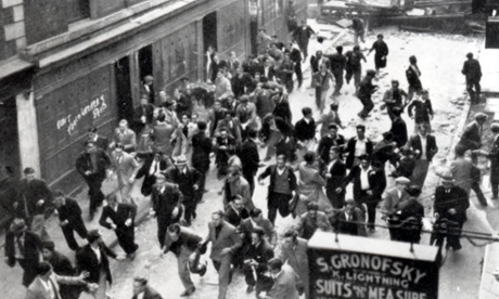 Anti-fascists running from a barricade they have erected near Aldgate during a police charge in the Battle of Cable Street in October 1936.