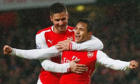 Goalscorer Arsenal's Alexis Sanchez gets a hug from Olivier Giroud.