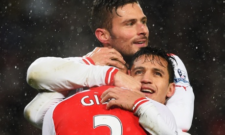 Alexis Sánchez of Arsenal celebrates his goal with Olivier Giroud and Kieran Gibbs, during his side's victory over QPR in the Premier League.