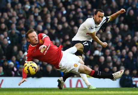 Wayne Rooney in the thick of the action again as he attempts to block an Andros Townsend effort.
