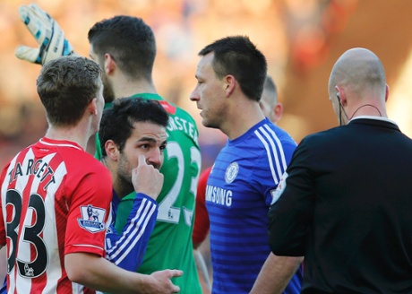 Cesc Fabregas reacts after being booked for diving in the area by referee Anthony Taylor.