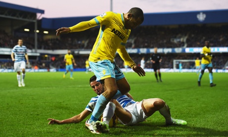 Stalemate at Loftus Road, here Mauricio Isla tackles Jason Puncheon.