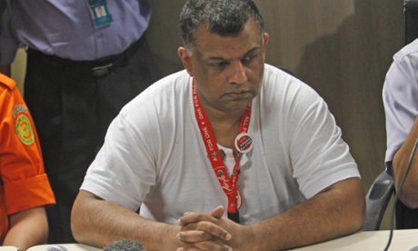 AirAsia Group CEO Tony Fernandes ponders during a press conference at Juanda International Airport in Surabaya, East Java, Indonesia, Sunday, Dec. 28, 2014.