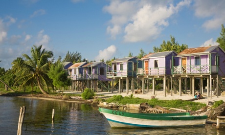 Wooden beach cabanas in Caye Caulker.