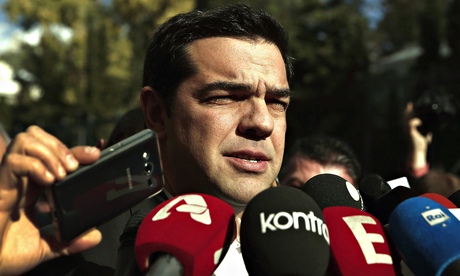 Syriza leader Alexis Tsipras talks to reporters outside the Athens parliament after the last round o