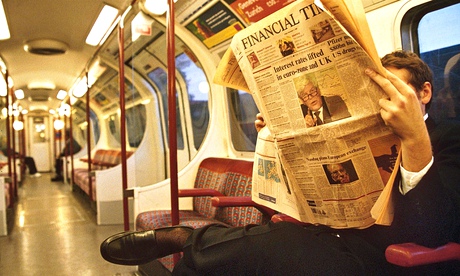 FTSE Man reading Financial Times on tube