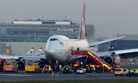 Emergency vehicles attend to the Virgin Atlantic Boeing 747 at Gatwick airport.