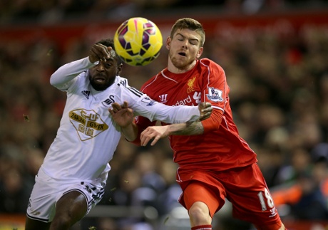 Nathan Dyer and Alberto Moreno clash.