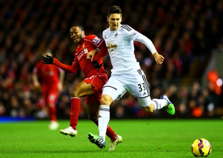 Federico Fernandez fends off Raheem Sterling.