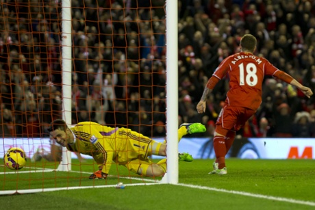 Swansea's goalkeeper Lucasz Fabianski smiles after failing to keep out Alberto Moreno's shot from close range.