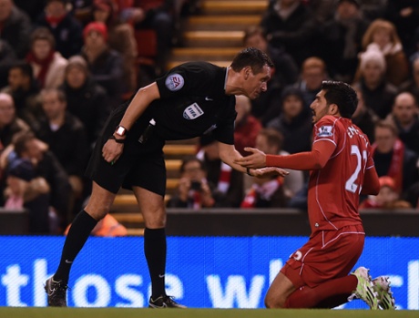 Liverpool's German midfielder Emre Can speaks with referee Andre Marriner. Can appeared to be elbowed in the face by Jonjo Shelvey.