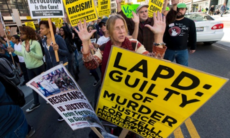 People rally in downtown Los Angeles to protest police brutality 13 December 2014.