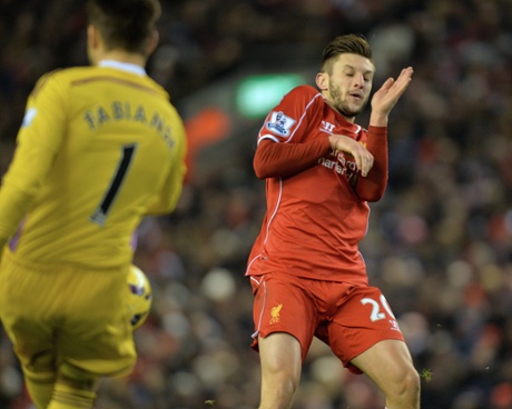 Adam Lallana closes in on Fabianski.