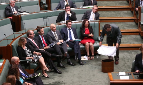 An attendant places towels under a leak in the roof during question time in the House of Representatives in Parliament House Canberra this afternoon, Wednesday 3rd December 2014.