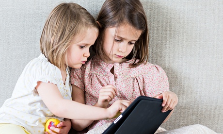 Children playing with a tablet computer