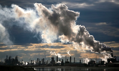 View of smoke plumes emitted from the Syncrude upgrader plant north of Fort McMurray, northern Alberta, Canada.