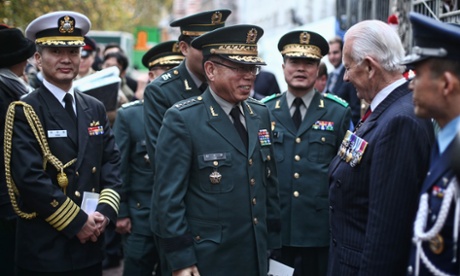 Korean officials are greeted as they arrive for the unveiling ceremony of London's Korean war memorial.