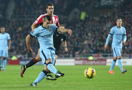 Manchester City's Argentinian striker Sergio Aguero shoots to score the equaliser.