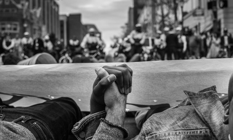 People of all races come together for #phillydiein.  Two protesters join hands for die in during Philadelphia protest against police brutality